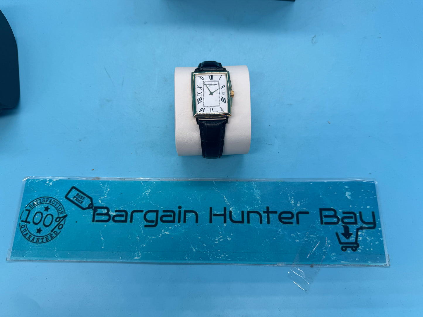 Black leather strap of Raymond Weil Toccata watch showing butterfly clasp and 20mm lug width